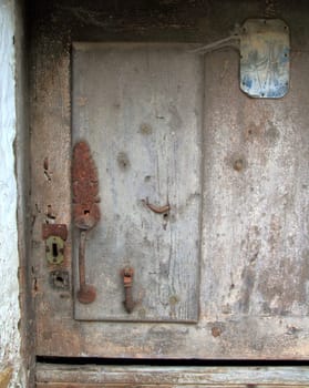 aged wood door weathered vintage rusty iron door knob and lock