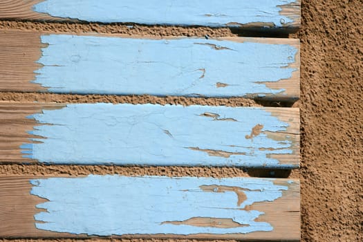 aged beach blue wooden floor over summer sand