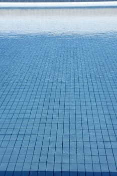 Blue tiles pool  water waves perspective summer background
