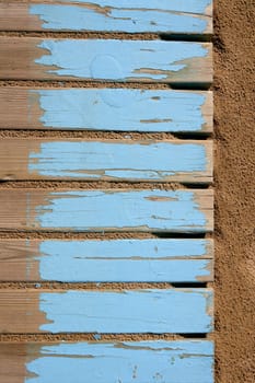 aged beach blue wooden floor over summer sand