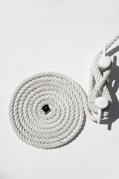 spiral white sea nautical rope on sailboat boat mooring