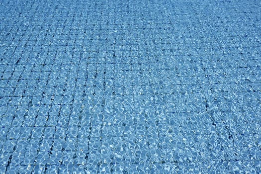 Blue tiles pool  water waves perspective summer background