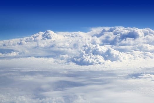 blue sky high view from airplane clouds like a mountain shapes