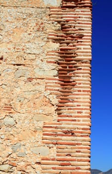 bricks corner detail in masonry wall from ancient monastery architecture in spain