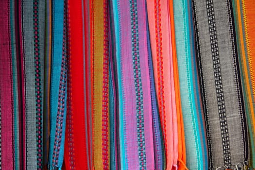 Indian colorful scarf in a row with vivid colors stripes