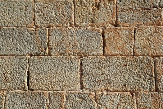 Castle masonry wall carved stone rows pattern ancient texture from Spain