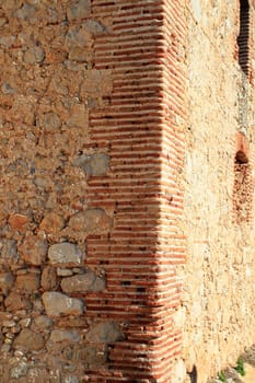 bricks corner detail in masonry wall from ancient monastery architecture in spain
