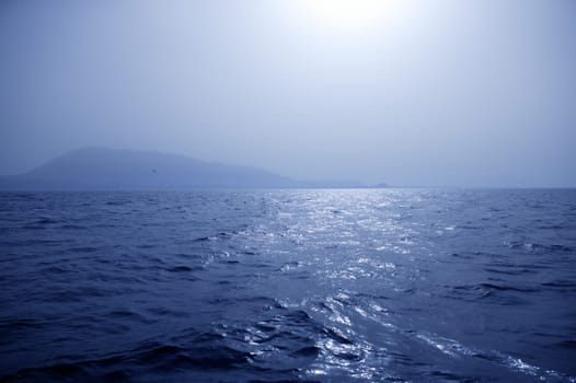 Foggy Mediterranean morning on the blue sea