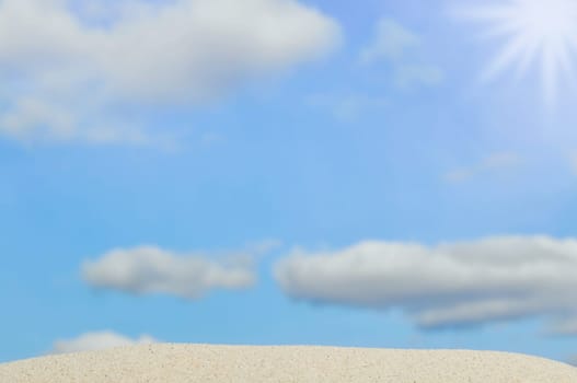 beach and blue sky in background. Focus on the sand