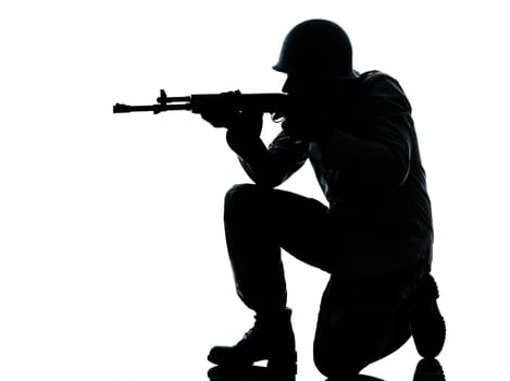 one caucasian army soldier man shooting on studio isolated on white background