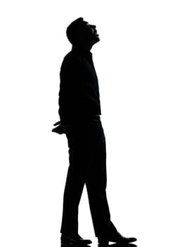 one caucasian business man looking up mouth open  silhouette Full length in studio isolated on white background