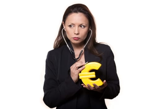 Portrait of expressive woman examining euro and looking away in studio isolated on white background