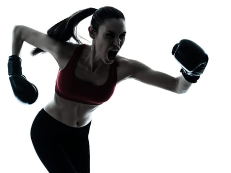 one caucasian woman boxing exercising in silhouette studio isolated isolated on white background