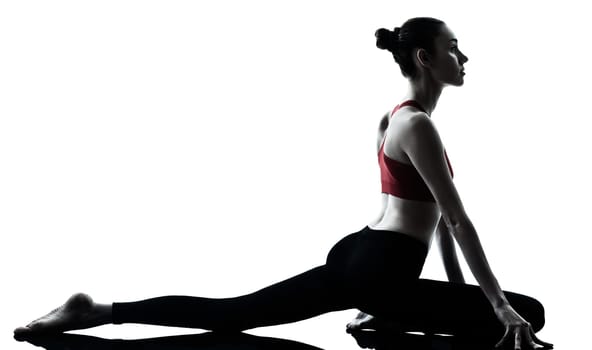 one caucasian woman exercising yoga in silhouette studio isolated isolated on white background