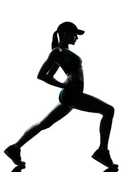one caucasian woman runner jogger  stretching warm up in silhouette studio isolated on white background