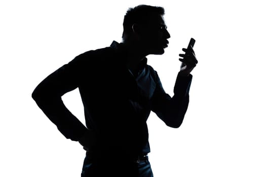 one caucasian man  telephone videophone  portrait silhouette in studio isolated white background