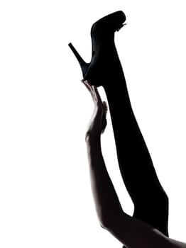 one woman legs silhouette on studio isolated white background