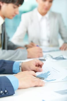 Close-up of male hands holding documents