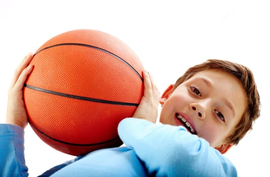 Portrait of a boy holding a basketball ball