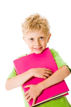 Portrait of schoolboy holding textbook on a white background