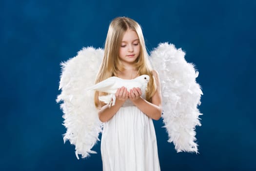 Portrait of light angel with purely white dove looking at it with love