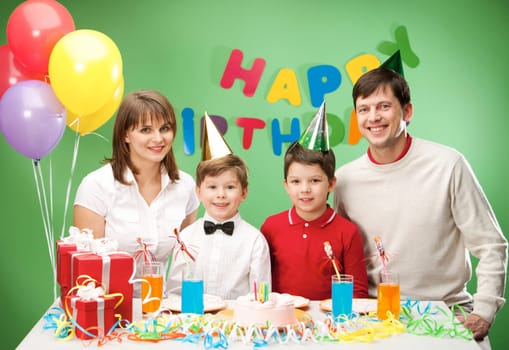 Portrait of family together sitting at the holiday table