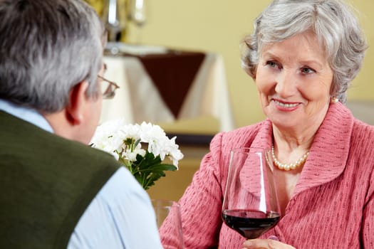 Image of beautiful senior woman looking at her husband with love