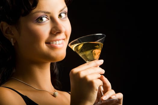 Portrait of charming woman holding cocktail with champagne
