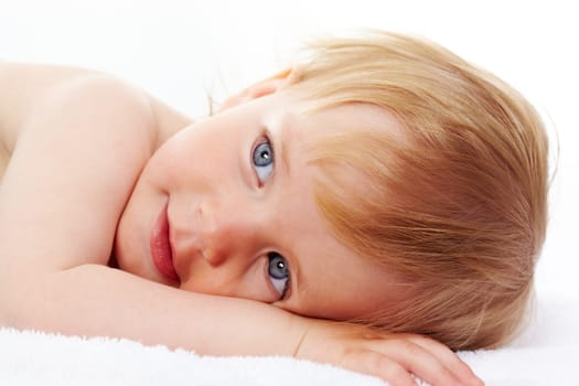 Portrait of small girl relaxing with serene expression