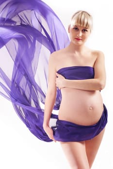 Studio shot of beautiful pregnant woman