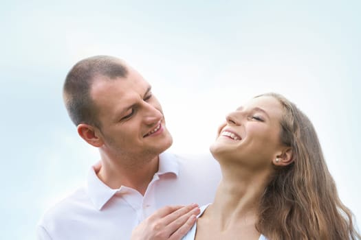 Happy man looking at content female outdoors