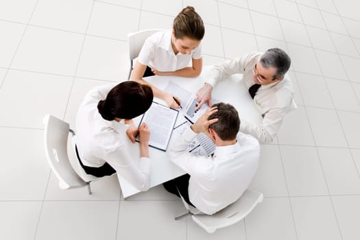 Above view of business workteam thinking about new project at meeting