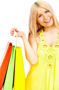 Happy female with bags looking at camera with smile