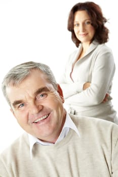 Portrait of a happy senior man and his wife standing behind
