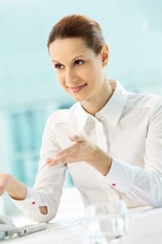 Photo of smiling businesswoman sharing ideas in office
