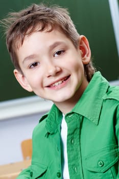 Portrait of smart lad at his place looking at camera