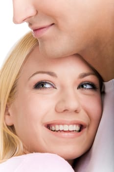 Face of laughing girl looking aside on her boyfriend shoulder