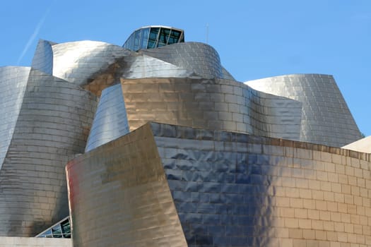 BILBAO, SPAIN - JULY 30: Exterior view of the Guggenheim Museum at sunset on July 30, 2011 in Bilbao, Spain. This Museum is dedicated exhibition of modern art and was designed by Frank Gehry.