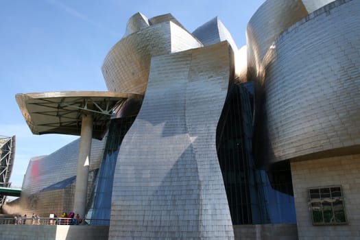 BILBAO, SPAIN - JULY 30: Exterior view of the Guggenheim Museum at sunset on July 30, 2011 in Bilbao, Spain. This Museum is dedicated exhibition of modern art and was designed by Frank Gehry.