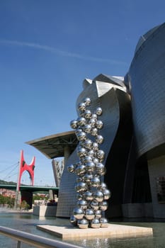 BILBAO, SPAIN - JULY 30: Exterior view of the Guggenheim Museum at sunset on July 30, 2011 in Bilbao, Spain. This Museum is dedicated exhibition of modern art and was designed by Frank Gehry.