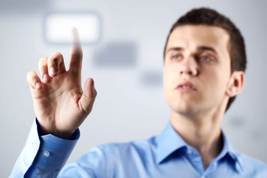 Confident businessman pressing button