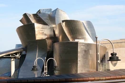 BILBAO, SPAIN - JULY 30: Exterior view of the Guggenheim Museum at sunset on July 30, 2011 in Bilbao, Spain. This Museum is dedicated exhibition of modern art and was designed by Frank Gehry.