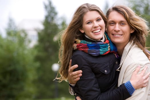 Portrait of excited couple embracing each other