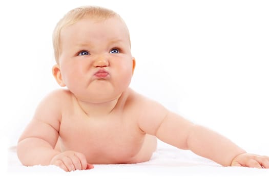 Portrait of small girl with capricious expression looking upwards