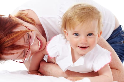 Portrait of happy woman playing with her small daughter