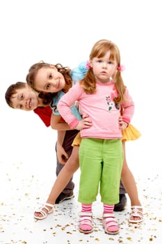 Portrait of smart girl standing before her happy friends over white background