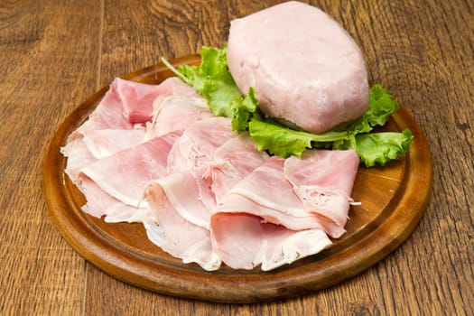 fresh ham on wooden board
