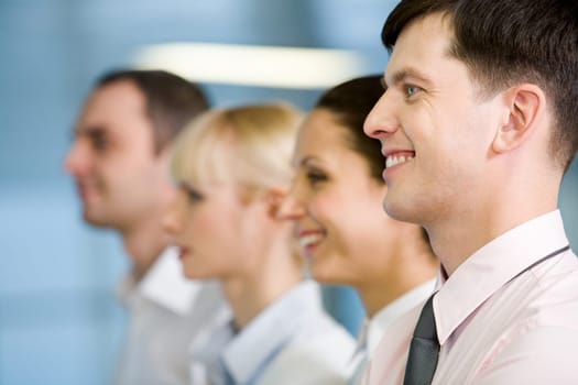 Image of business group standing in line with handsome leader in front