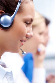 Vertical image of business customer support operators with woman in front