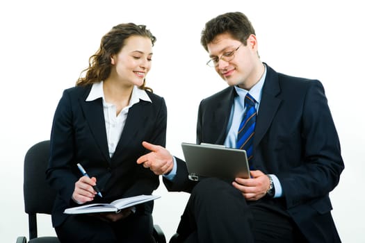 Photo of successful business people looking at laptop screen at meeting while discussing working plans
